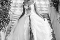 02 illusion neckline sheath wedding dress with a layered overskirt looks heavenly