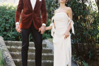 03 One of her dresses was an off the shoulder one with a side slit, while the groom was wearing black pants and a burnt orange velvet jacket