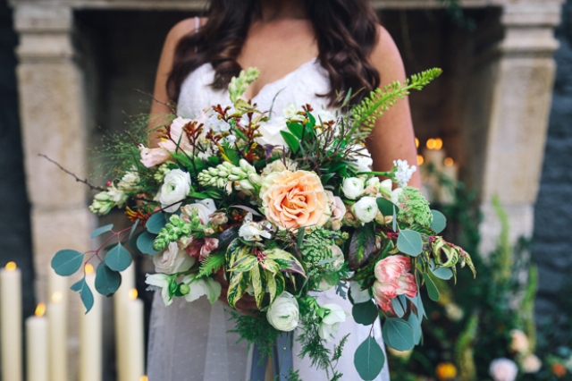 The bridal bouquet was made with different flowers and leaves in peachy and creamy tones