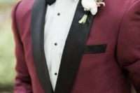 03 a burgundy and black wedidng suit with a white shirt and a black bow tie