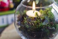03 a glass bowl with moss and a tealight is a simple and cheap idea for a woodland wedding