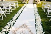 03 a gorgeous castle garden with manicured lawns and lush white florals for your wedding ceremony