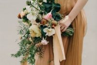 03 copper and mustard wedding dress, a bouquet of emerald greenery and neutral blooms