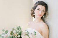 The bridal bouquet featured greenery, blush and white blooms