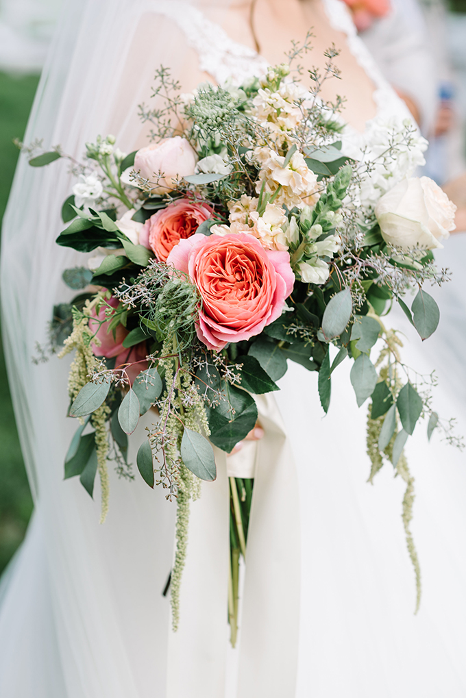 The bridal bouquet with much greenery and pink and blush flowers, pure tenderness