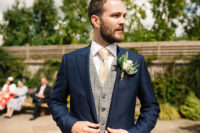 05 The groom was wearing a navy suit with a grey waistcoat and a beige tie