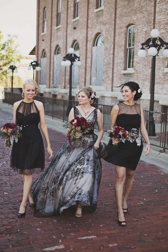 a black lace over the blush gown wedding dress and illusion neckline short bridesmaids gowns in black