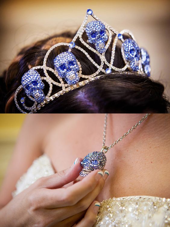 a blue rhinestone skull crown and a matching necklace for a daring bride