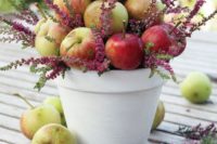 05 a white planter filled with apples and wildflowers for a summer or spring wedding