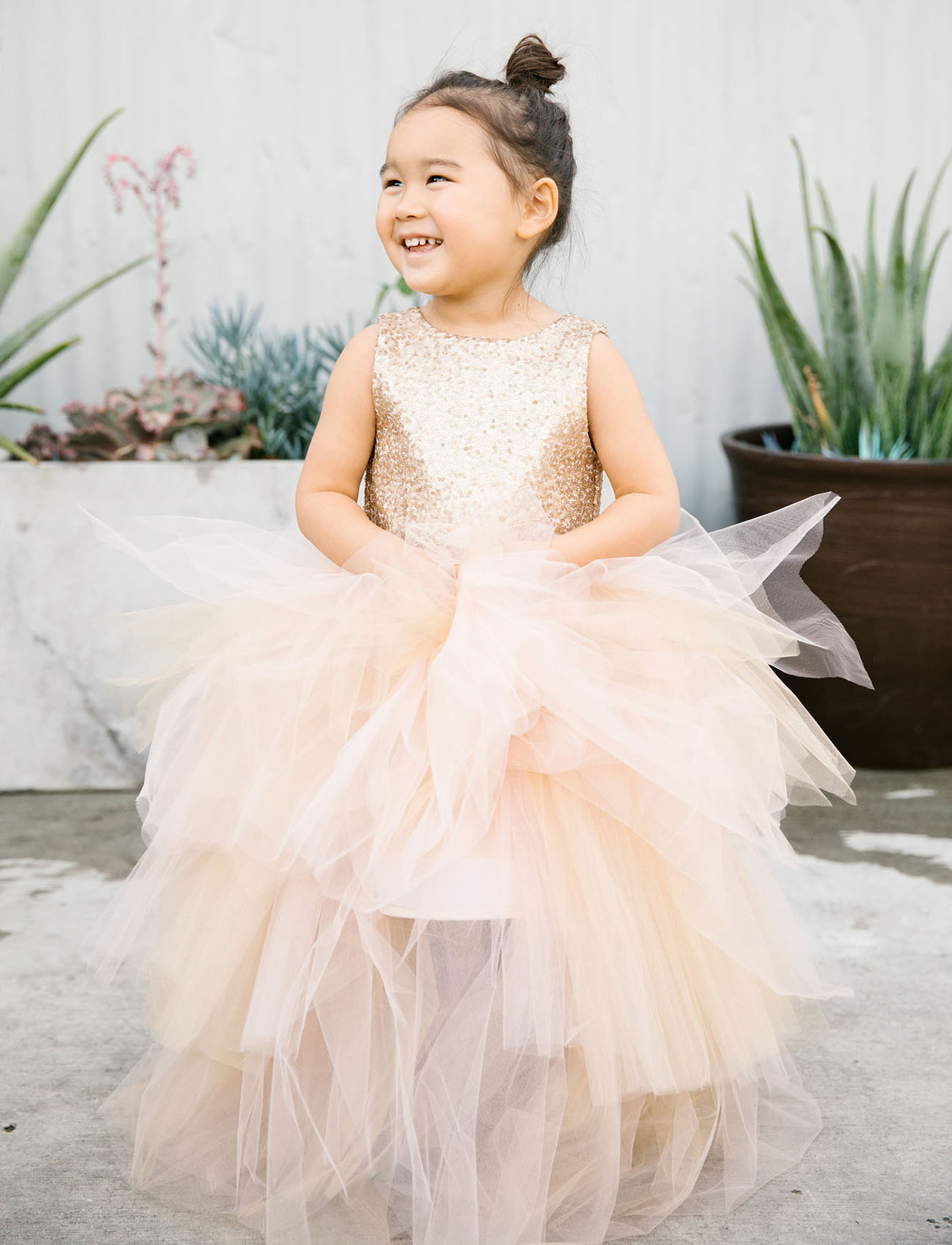 The flower girl in sequins and tulle by Miss Tashina looked heavenly