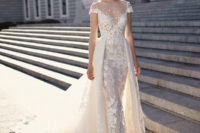 06 a sheath lace wedding dress with an illusion neckline and a lace overskirt