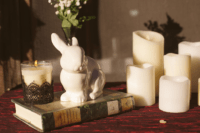 07 The tablescapes were decorated in grey and red, with lots of candles and toy bunnies as the couple’s pet is a bunny