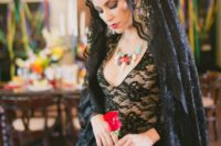 07 a black lace wedding gown and a black lace veil for a Day of The Dead wedding