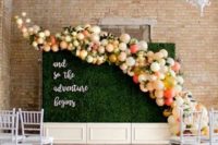 07 a living wall with a colorful balloon curve for a cool wedding backdrop