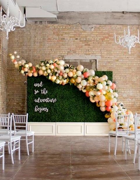 a living wall with a colorful balloon curve for a cool wedding backdrop