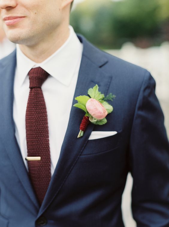 a navy two piece wedidng suit with a burgundy knit tie