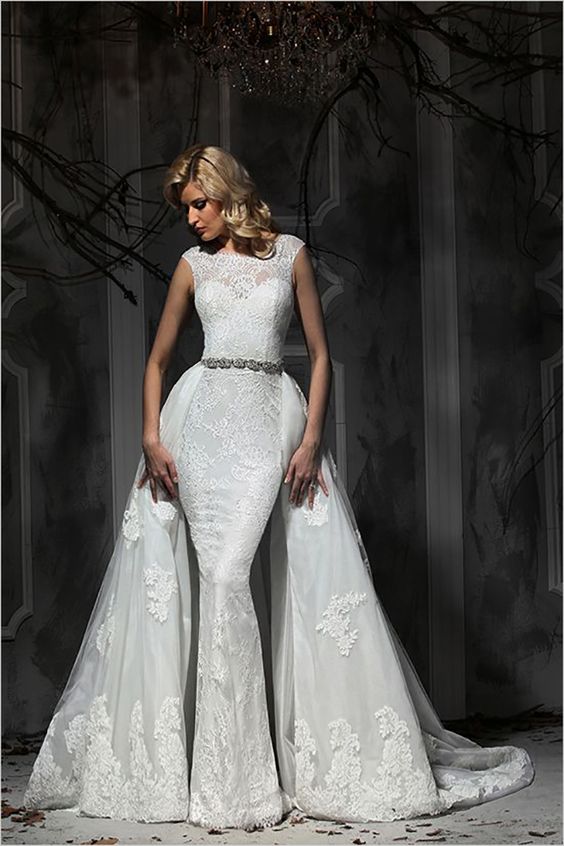 a sheath lace wedding dress with cap sleeves and a lace overskirt, an embellished belt