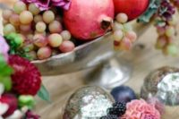 07 a silver bowl with grapes, pomagranates and burgundy dahlias for a fall wedding