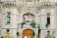 07 get married in front of the gorgeous castle gate or doors, decorate it with greenery and flowers