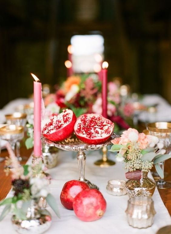 a vintage silver bowl with a pomegranate for a fall or boho lux wedding