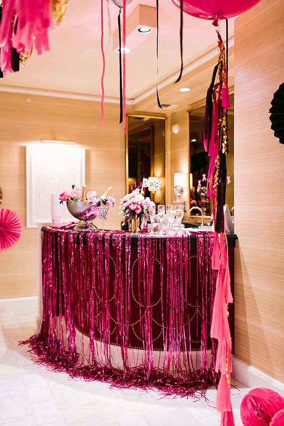 super colorful drink station for a bold bachelorette party in hot pink
