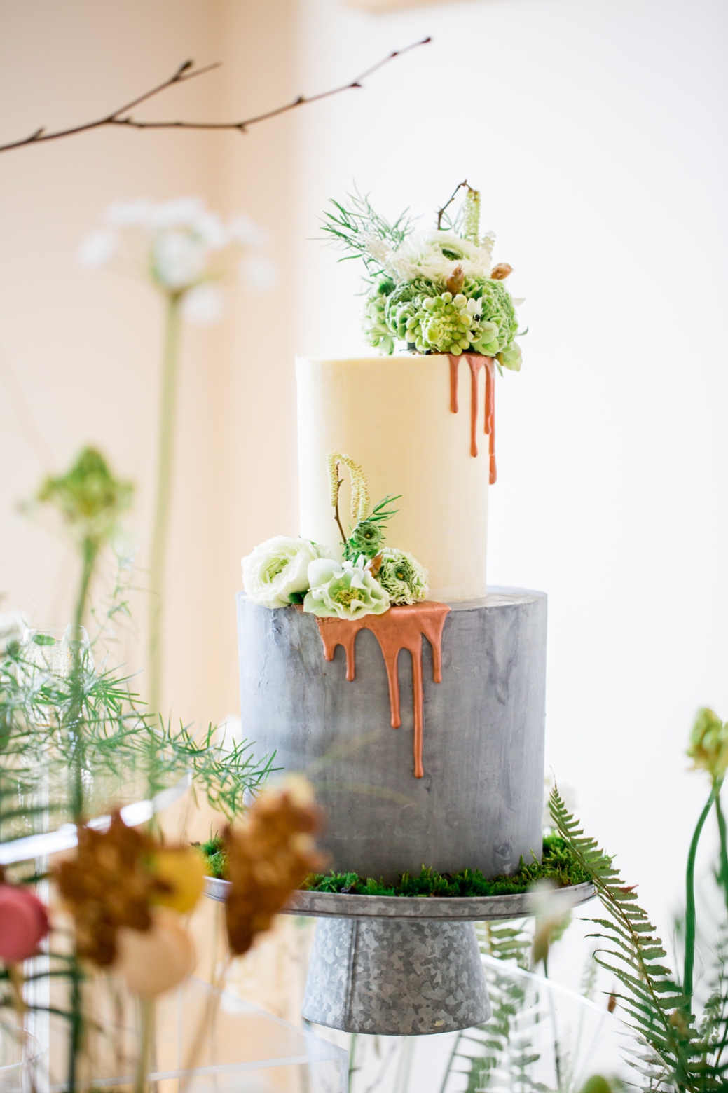 The wedding cake was a concrete-inspired one, with matte layers, drip icing and fresh blooms