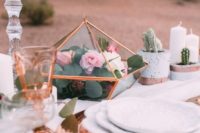 09 a copper charger, cutlery and a glass terrarium with greenery and pink blooms