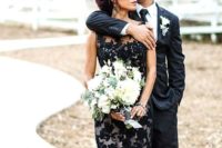 09 a trumpet wedding dress with a black lace layer over the neutral gown for a dramatic look
