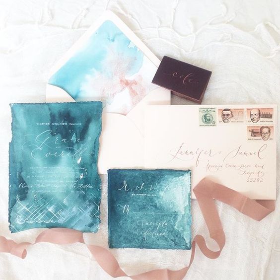 beautiful watercolor teal wedding stationary with white calligraphy and copper details