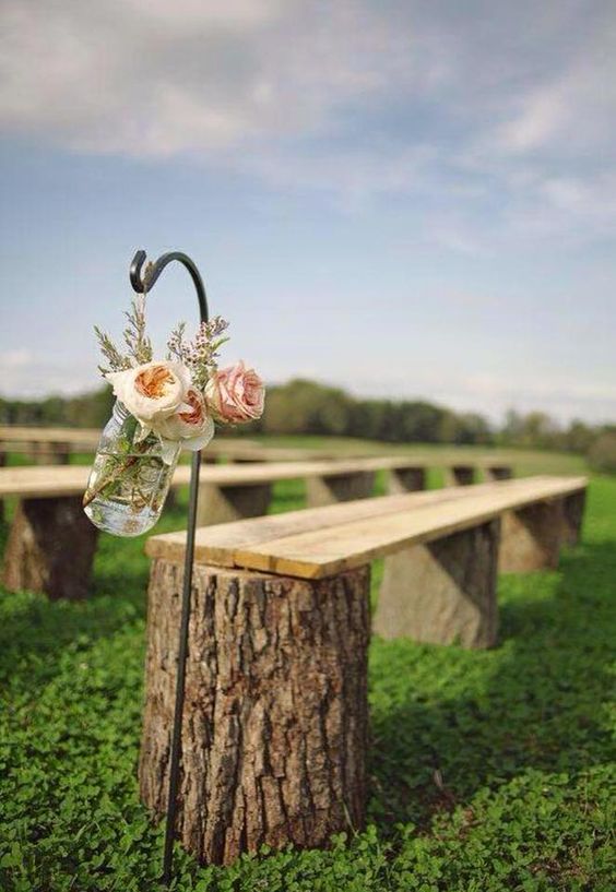 tree stumps with wooden planks on them, simple blooms are right what you need for a ranch wedding