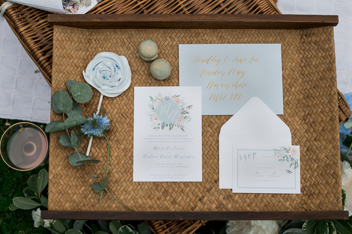 The wedding stationary was done in powder blue, peach and cream and with floral prints