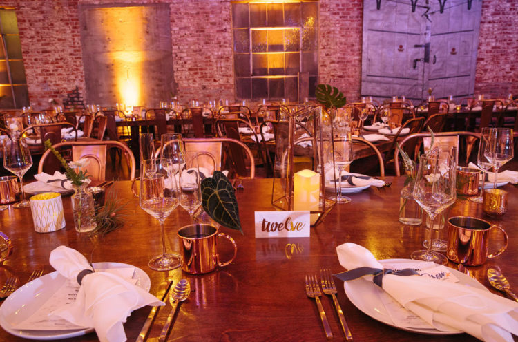 The wedding table setting was done in a blend of vintage, industrial and tropical styles and looked cute and welcoming