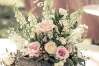 10 a wood box with pink roses and some wildflowers for a relaxed spring or summer wedding