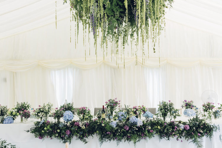 Lush florals and greenery made the reception amazing and gave it a wild feel