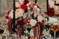 11 a lush decadent centerpiece with neutral, blush, red blooms and black grapes looks boho lux and jaw-dropping