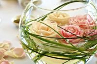 12 a bowl with greenery and floating roses in blush and pink is ideal for a garden wedding