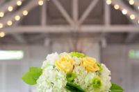 12 a glass vase with lime and lemon slices, red roses and white hydrangeas is great for a tropical wedding