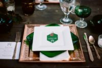 12 a place setting with a square copper charger, an emerald glass plate and an emerald place card