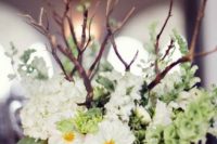 13 a wooden box with white blooms and branches for a rustic wedding