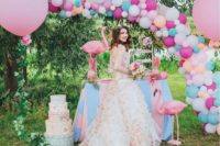 14 a colorful balloon arch over the dessert table for bold decor