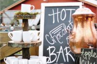14 a hot chocolate bar with mugs displayed on wood slices stands is a cute fall or Christmas idea
