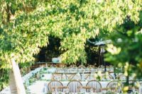 14 cozy wedding reception with much greenery and tables located to stimulate conversations