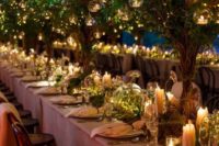 14 fairytale-inspired wedding reception with trees with candles and LED lights cloches