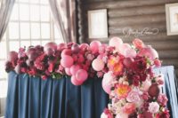 15 a sweetheart table decorated with an ombre pink to plum balloon and bloom garland