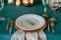 15 a teal tablecloth and glasses, copper chargers and jugs look chic