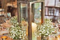 16 a wooden candle lantern, baby’s breath arrangements in mercury glass vases and flower petals