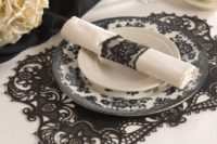17 a black lace paper placemat and a black lace napkin ring match for a dramatic tablescape