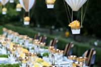 17 balloons in hot air balloons hanging over the reception create a dreamy ambience
