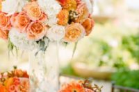 17 peachy, orange and creamy flower arrangement for a bold wedding