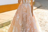 17 pink lace applique strap illusion plunging neckline wedding dress with an overskirt
